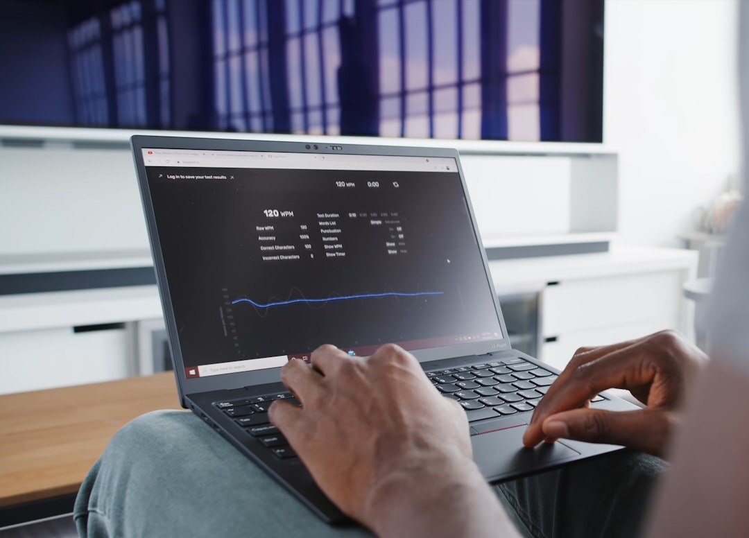 Data analytics dashboard on laptop screen with charts and graphs